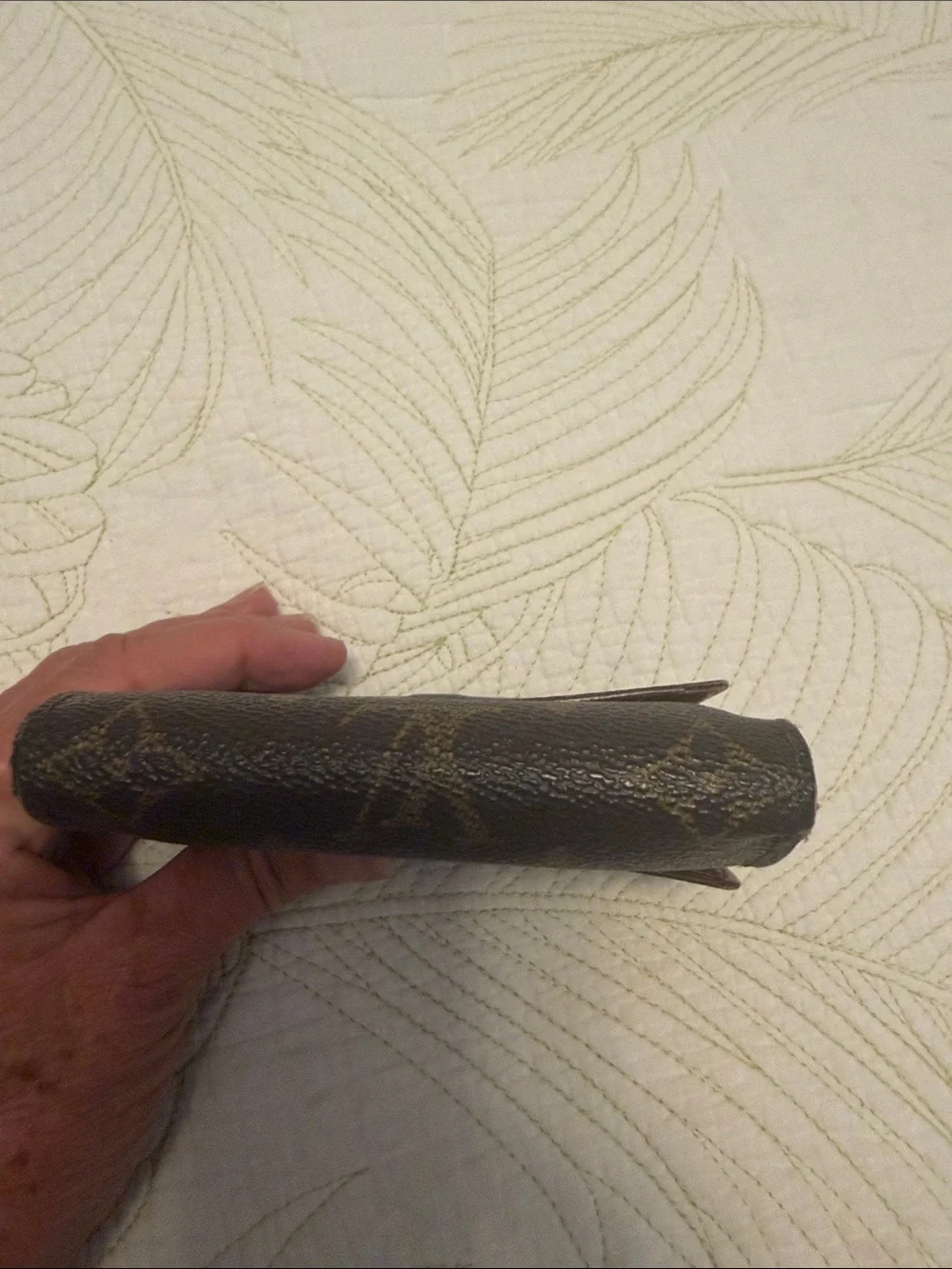 Louis Vuitton trifold snap wallet. Authentication provided.